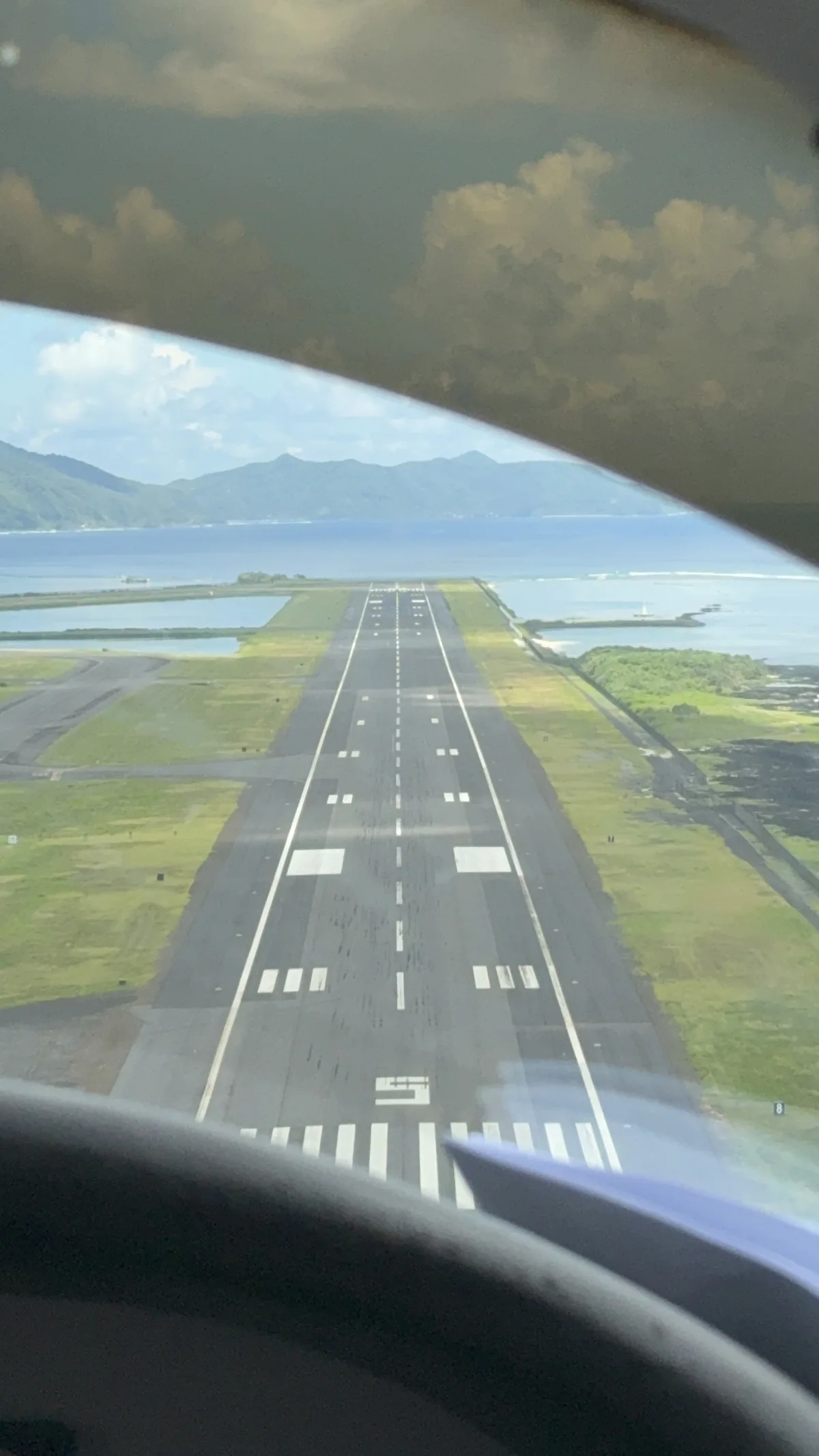 View of the runway and coast during the approach to Pago Pago