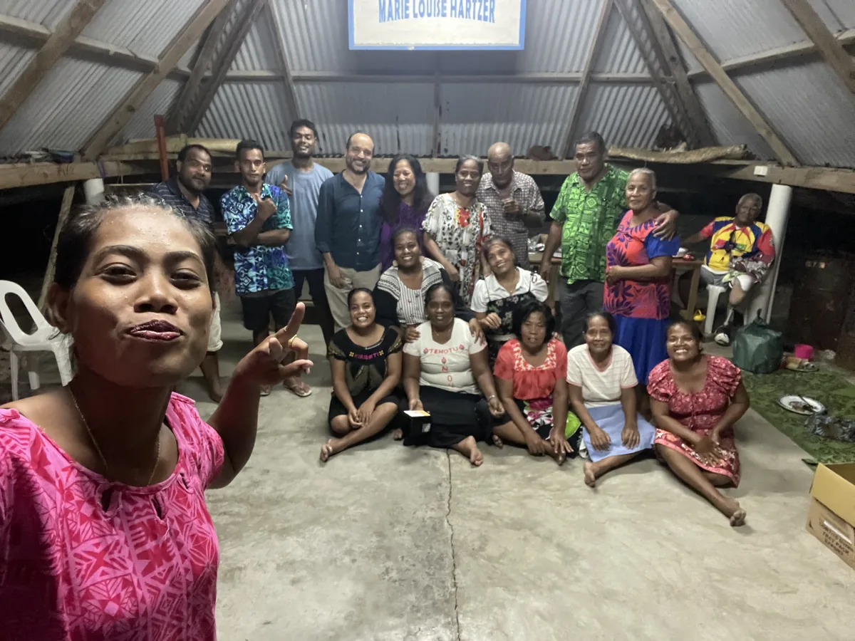 Evaristo with a group of people during the New Year’s Eve celebration in Kiribati