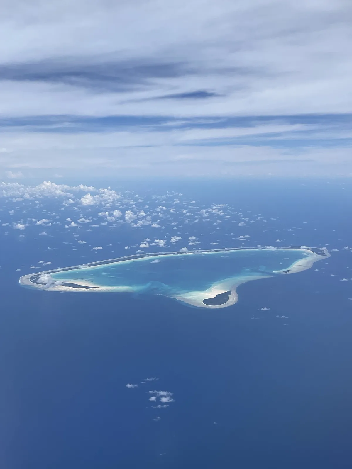 Aerial view of a Kiribati atoll surrounded by the ocean
